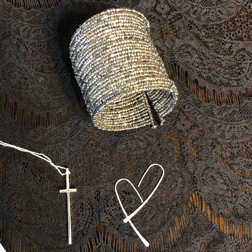 Silver toned beaded cuff bracelet.